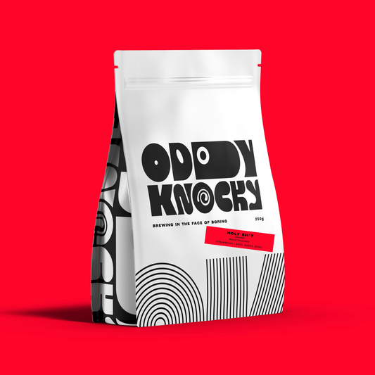 Speciality Coffee packaging for Holy Sh*t from Oddly Knocky, featured on a vibrant red background.