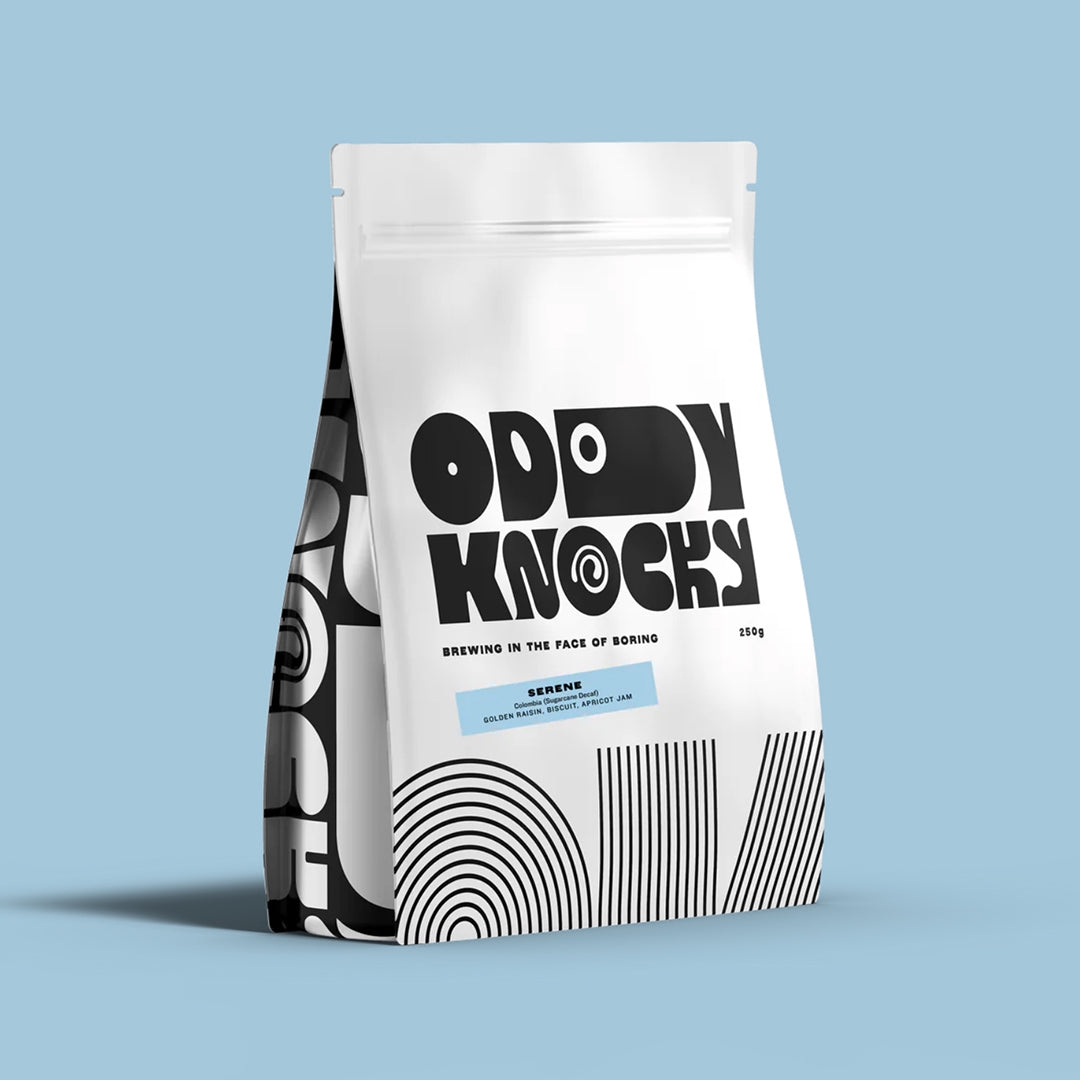 Serene Decaf Coffee packaging from Oddly Knocky displaying modern art design on a blue background.
