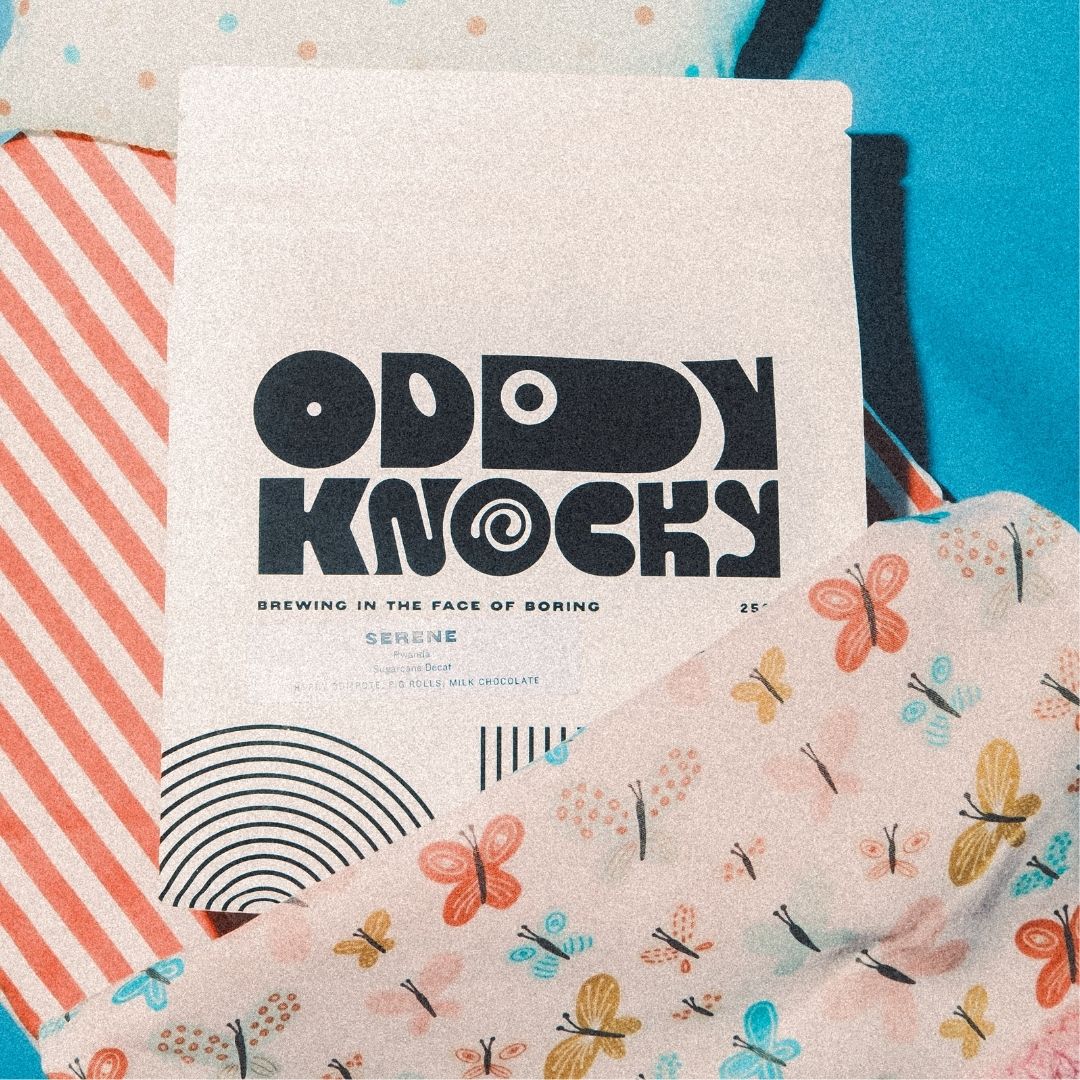 Serene Decaf Coffee packaging with colorful patterns and textures, featuring logo and vibrant background.