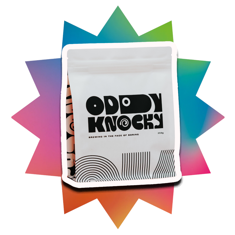 Oddy Knocky Coffee packaging with a star background