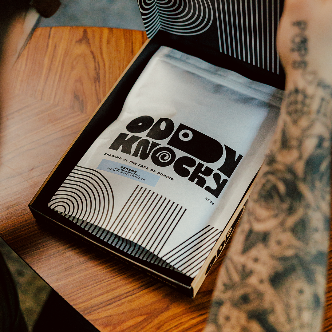 Decaf Coffee packaging from Serene in an open box with modern design and typography on the bag.